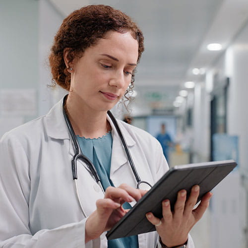 Doctor reading a tablet