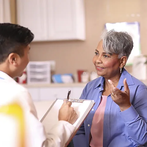 Doctor and senior adult patient in office
