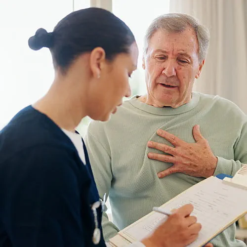 Man meeting with a nurse about chest pain