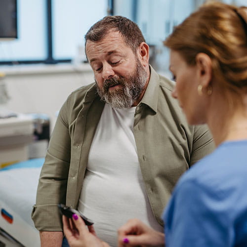 Medical professional checking glucose levels of a patient