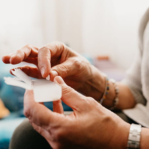 Woman holding a medicine's organizer