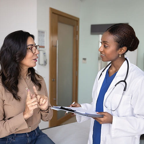 Doctor speaking with patient at an appointment 