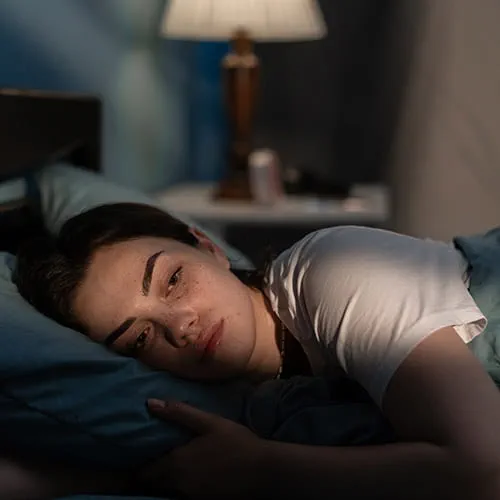 Woman lying in bed