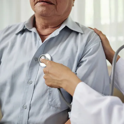 Doctor listening to a patient's heart with a stethoscope