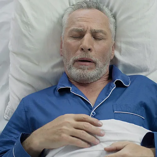 Man sleeping in a bed
