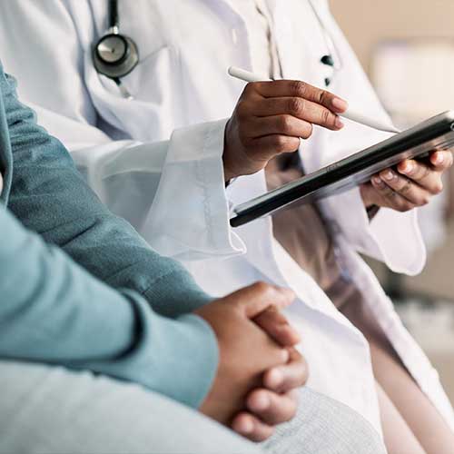 Tablet, hands and person with doctor for consultation with cold, flu and sickness symptoms. Digital technology, conversation and patient with healthcare worker for medical diagnosis in clinic.