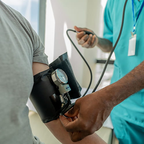 Medical professional checking a patient's blood pressure