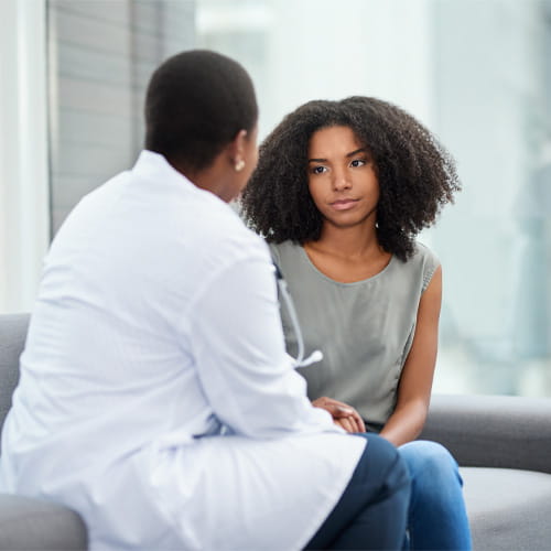 Shot of a young woman having a consultation with a doctor