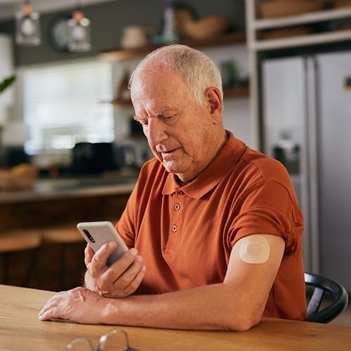 Senior man checking glucose on digital app