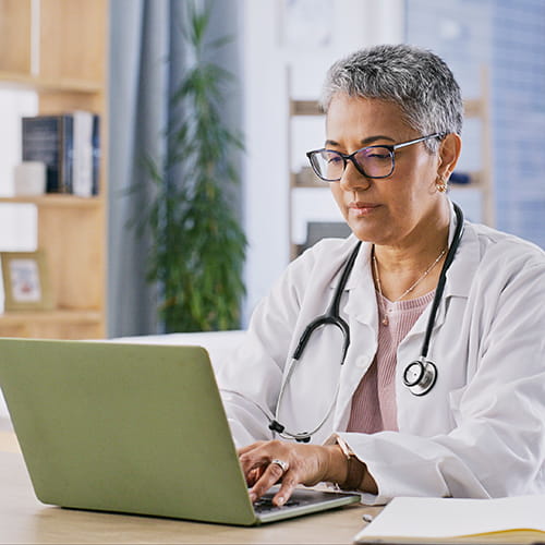 Doctor using a laptop.