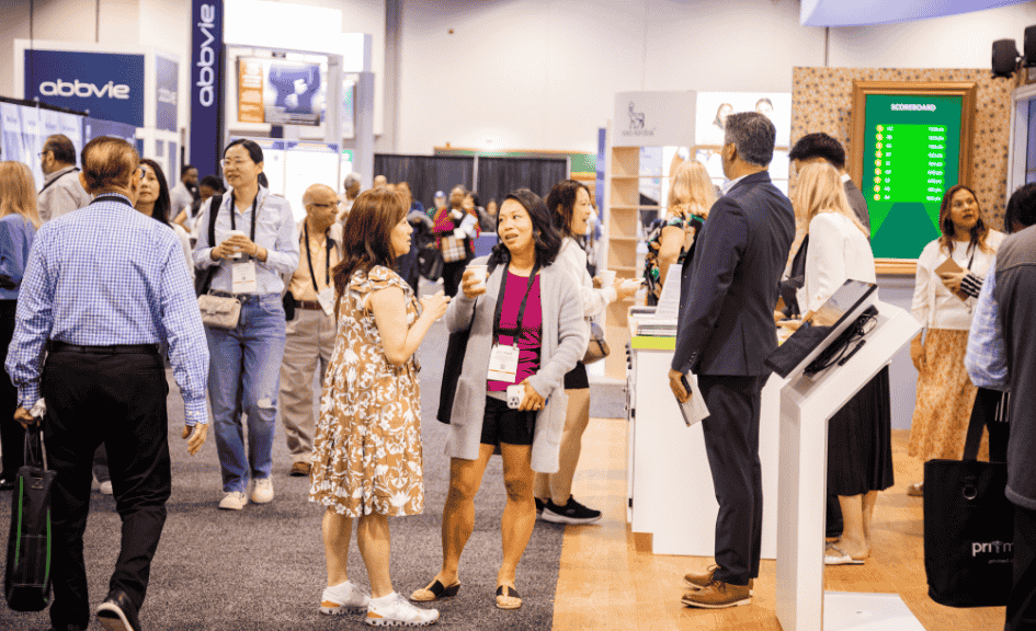 people talking and drinking coffee in the exhibit hall