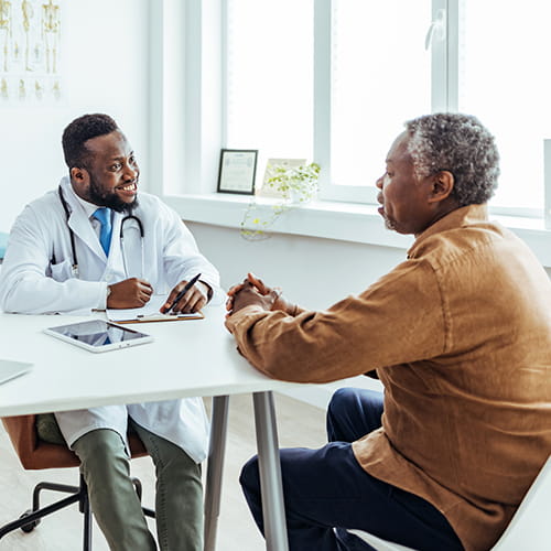 Senior man talking with his doctor.
