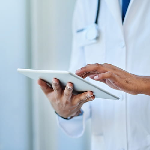 A doctor using a digital tablet.