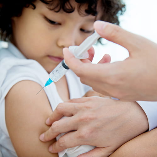 Child receiving a vaccine.