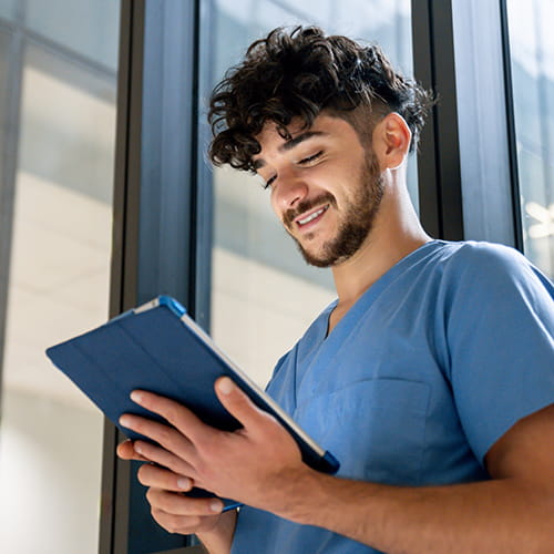 Med student reading a tablet.