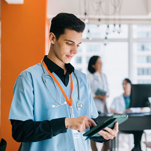 Medical student reading a tablet