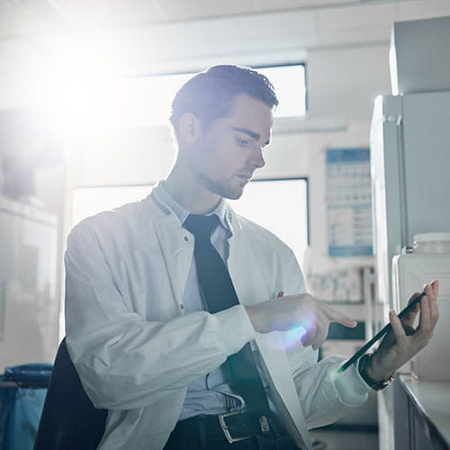 Medical student using a tablet in the lab