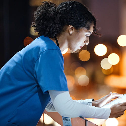 Clinician reading a tablet