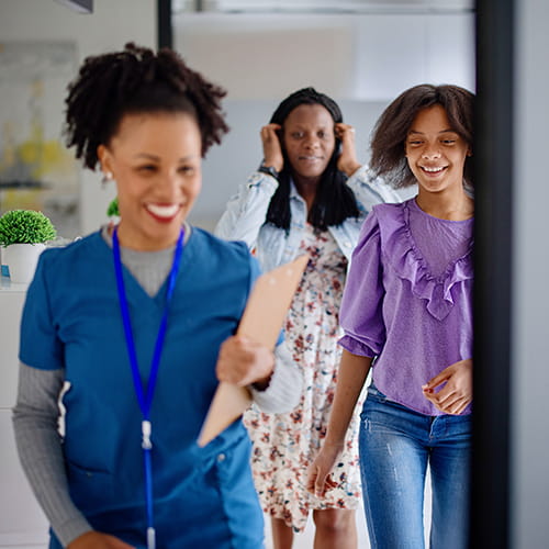 nurse with patient and her mother
