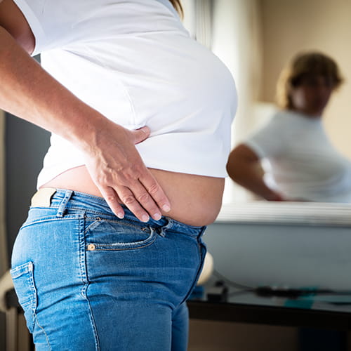 woman holding her stomach