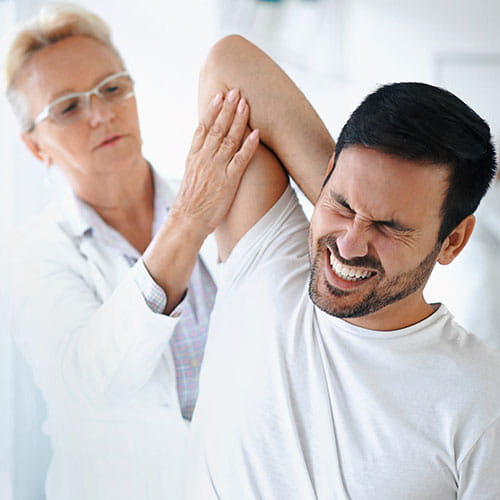 Doctor examining a patients arm