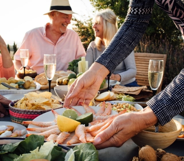people enjoying seafood in charleston