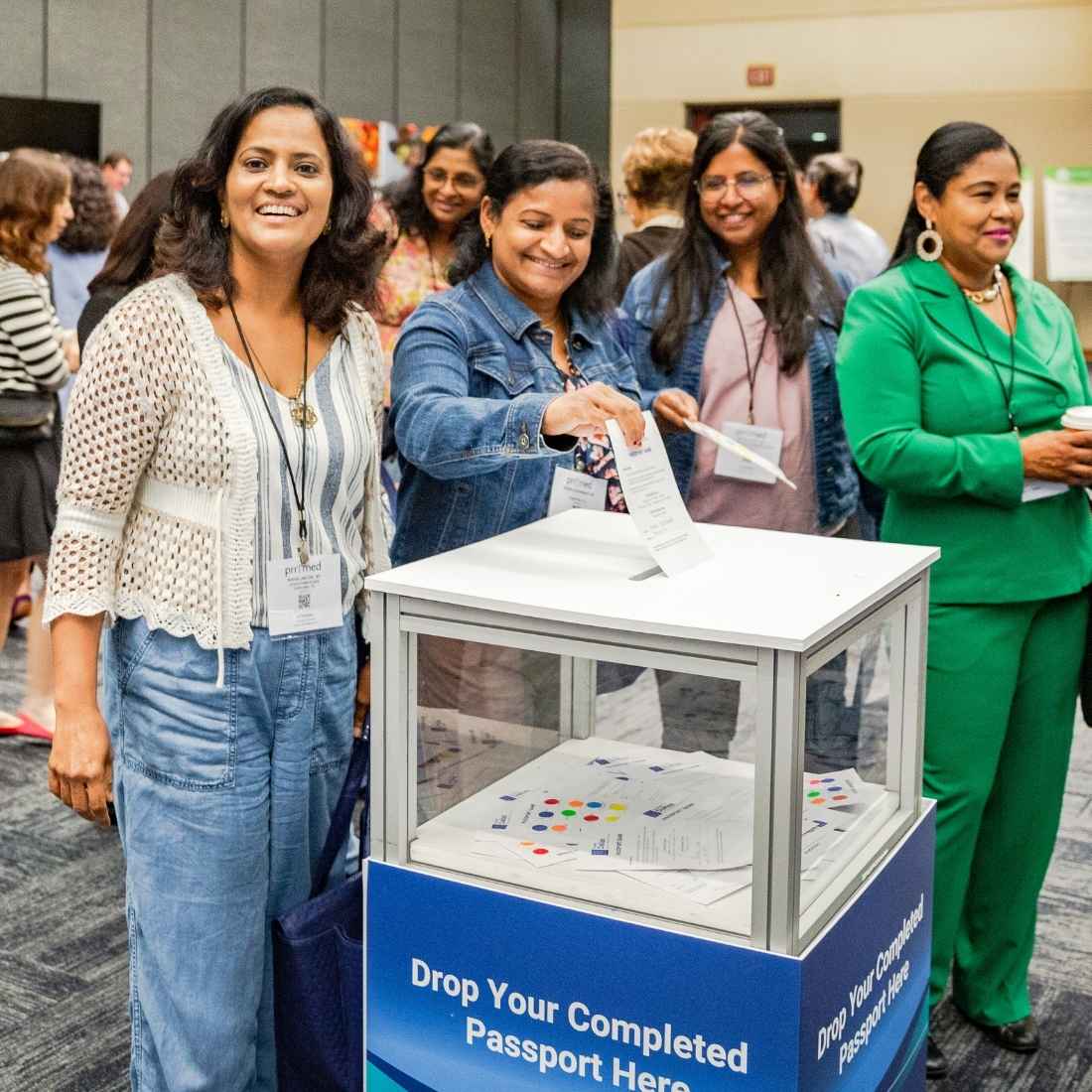 attendees participating in passport game at pri-med conference