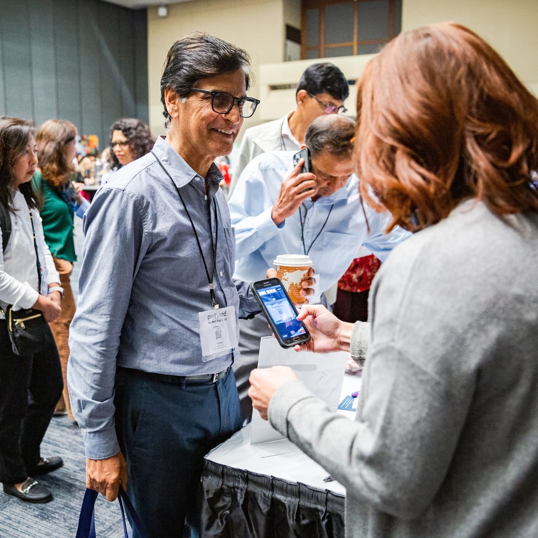 attendee smiling getting badged scanned