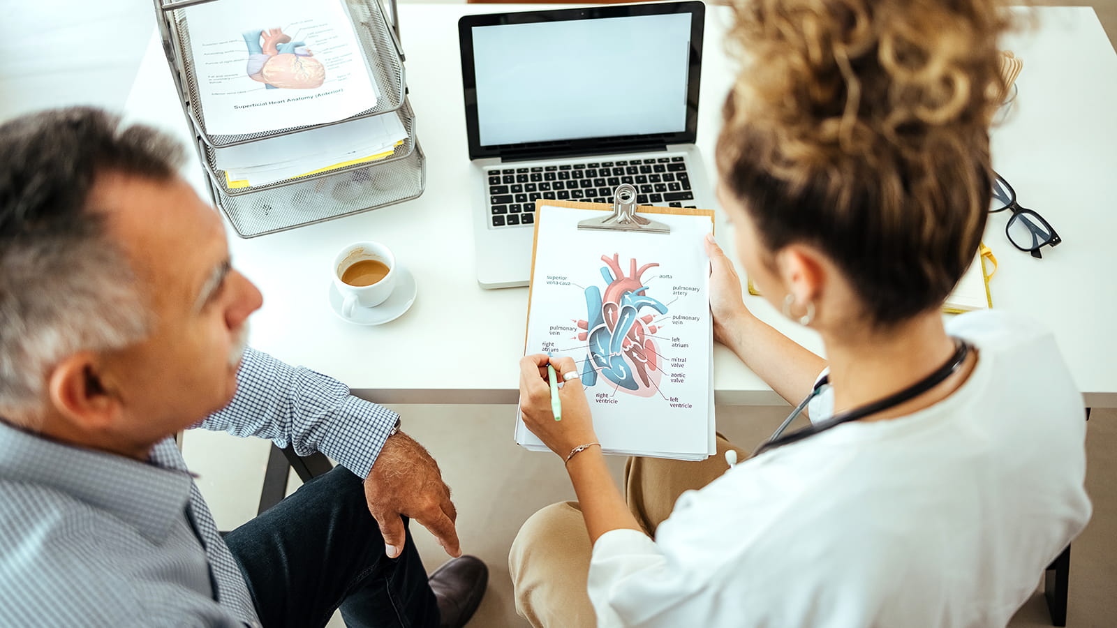 doctor showing patient a diagram