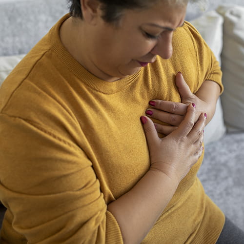 woman clutching her chest