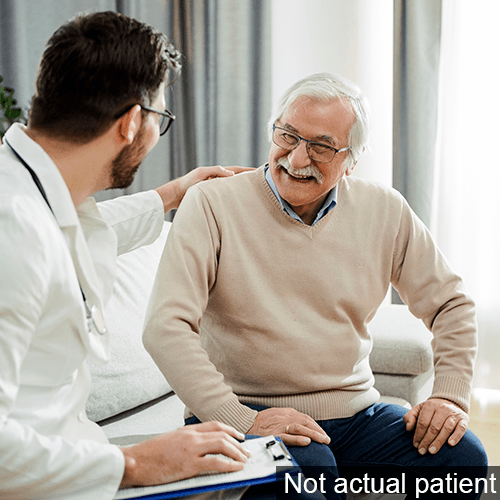 Doctor with arm on the back of a patient