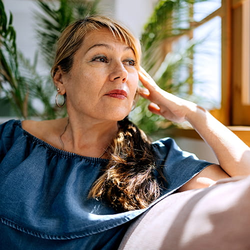 woman sitting near window