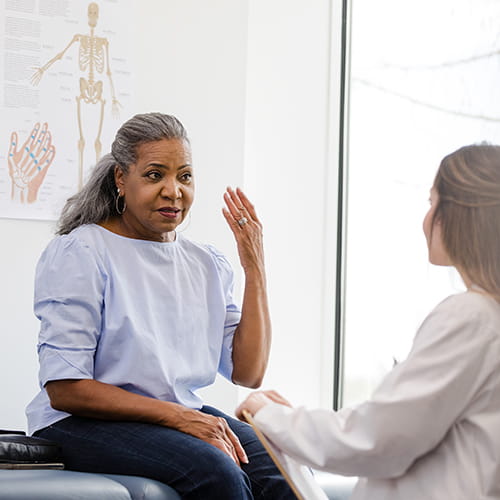 woman talking to doctor