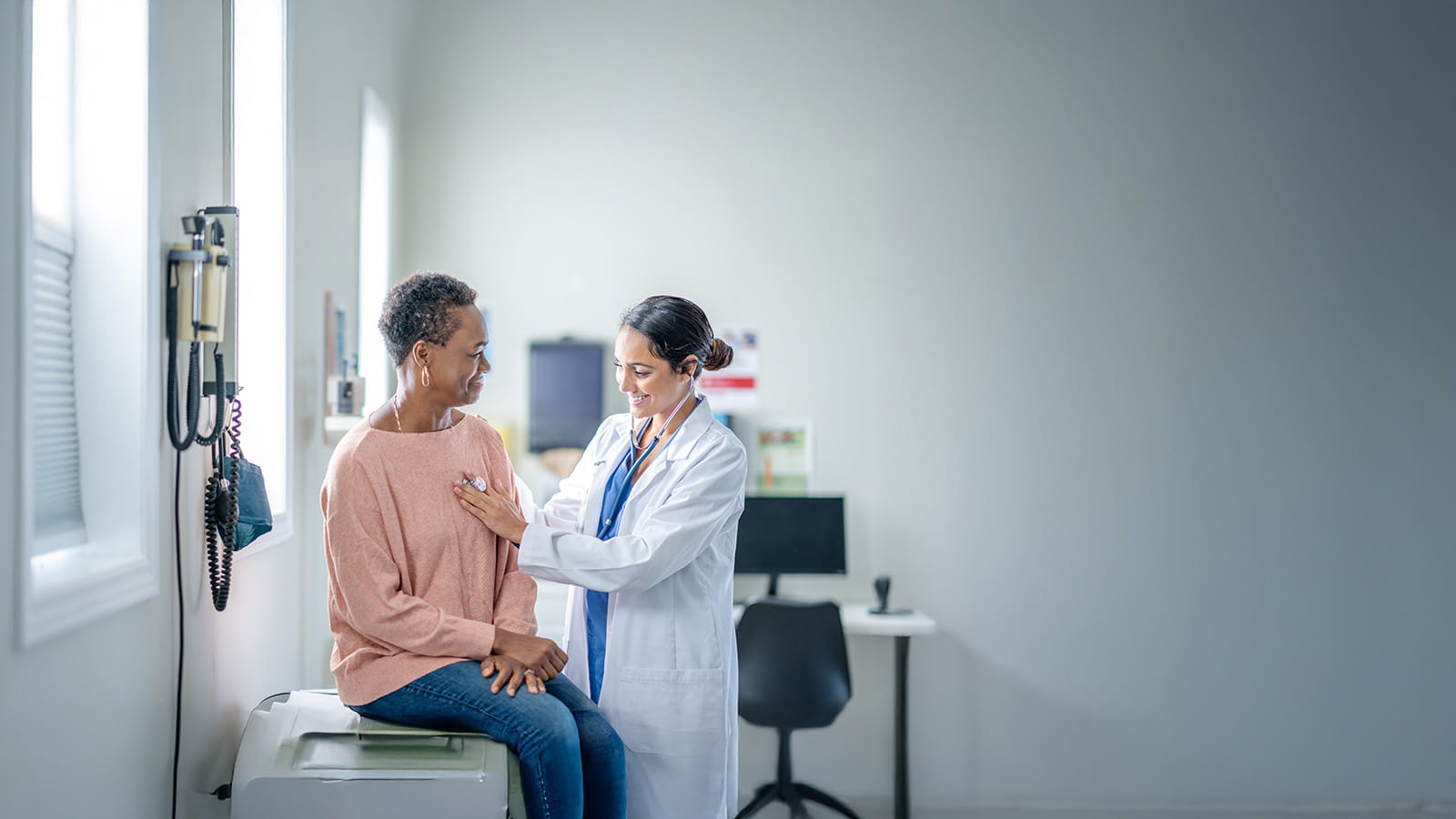 Doctor listening to a patients heart