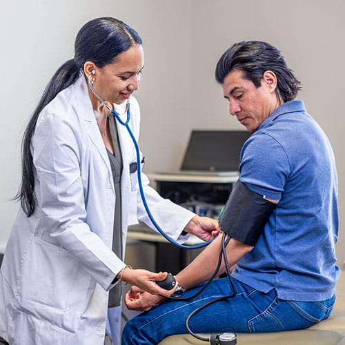 Doctor checking a patient's blood presure