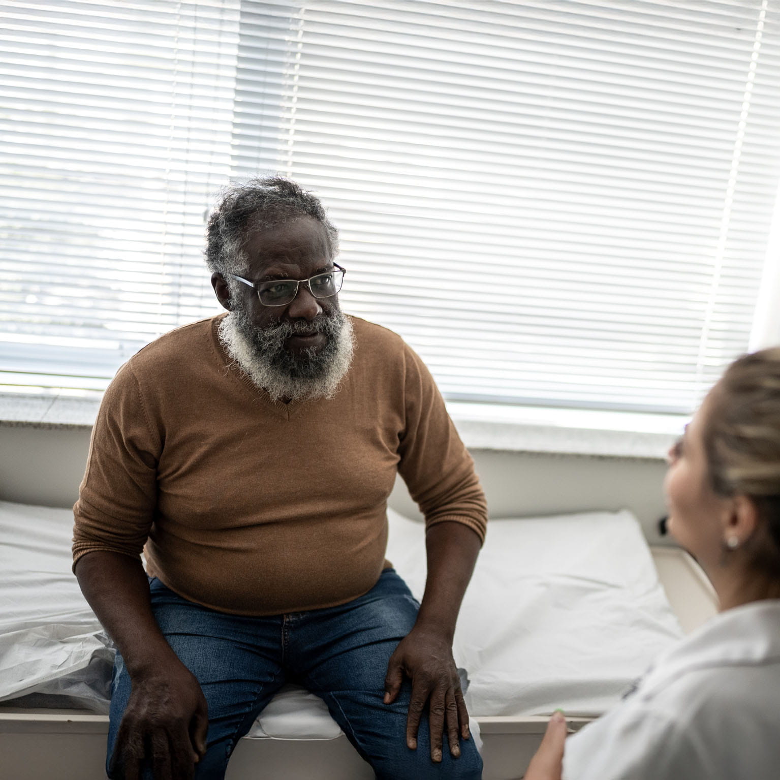 Doctor meeting with a patient in an office