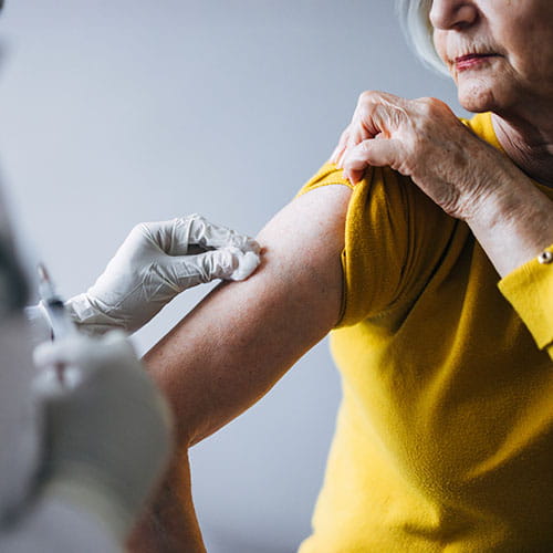 Woman receiving a vaccine