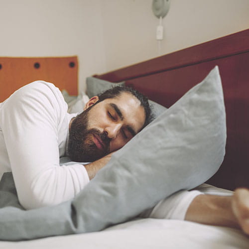 Man sleeping in a bed