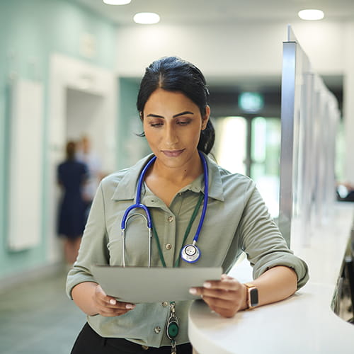 medical professional reviewing document