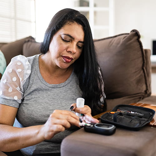woman checking her blood sugar