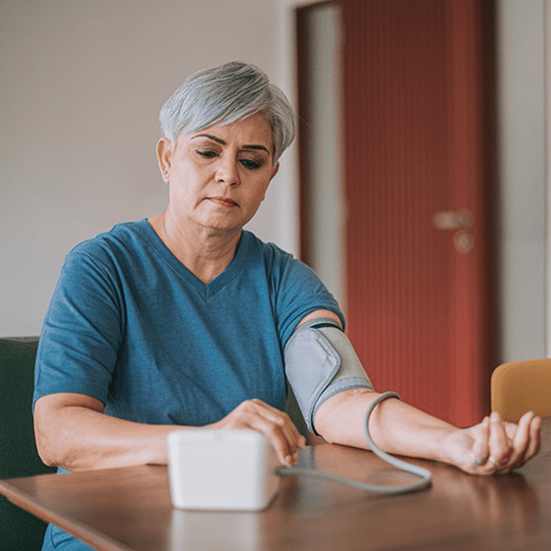 Woman taking her blood pressure