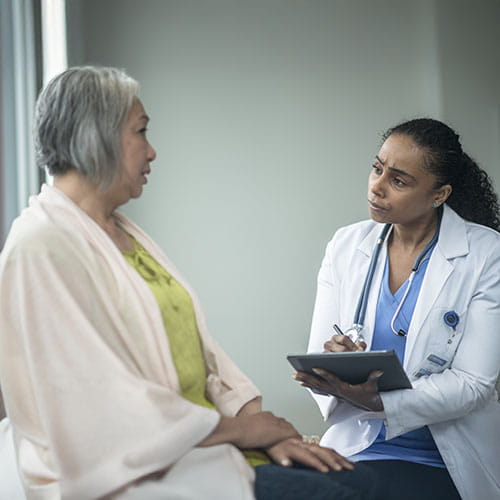 older woman with doctor