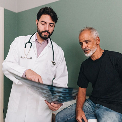 doctor showing a patient an xray
