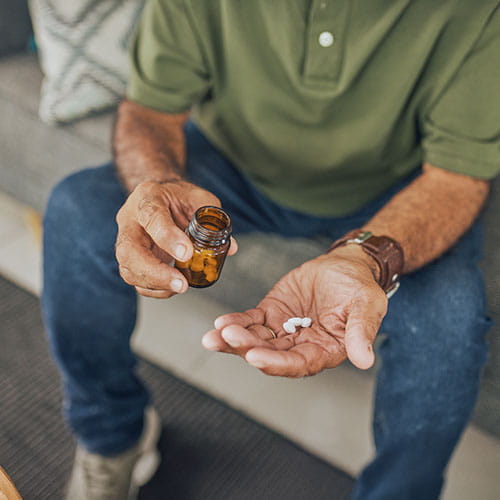 man holding pills