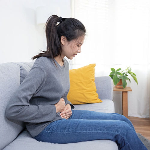 woman holding her stomach