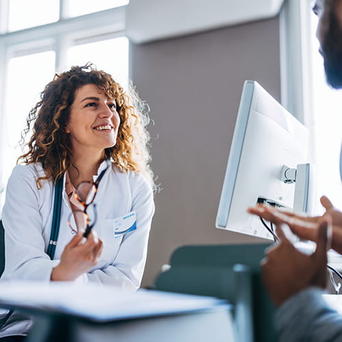 happy doctor talking to colleague