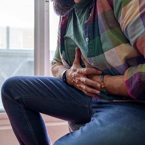 man holding his stomach