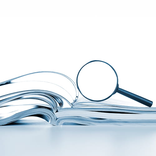 magnifying glass on a book