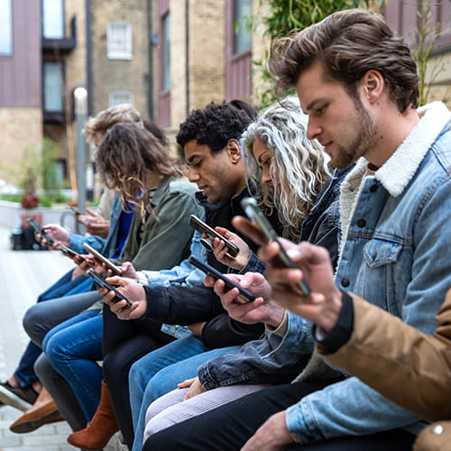 people looking at their phones