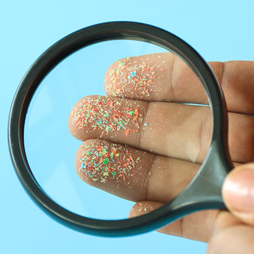 microplastics under magnifying glass